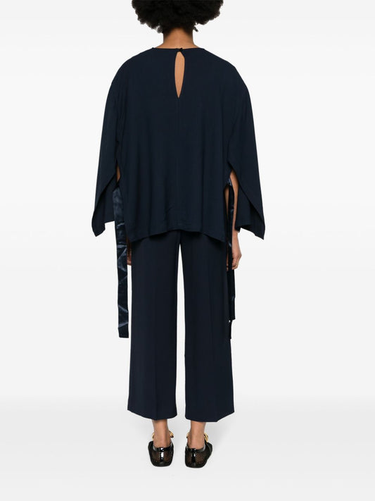 بلوزة إريكا كافاليني شبه مصممة، أزرق