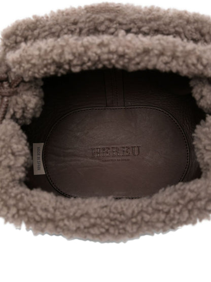 حقيبة يد هيريو من الجلد والجلد المقلب